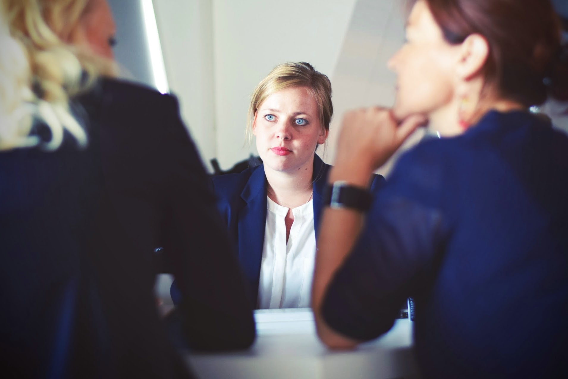 People sitting at a desk and talking